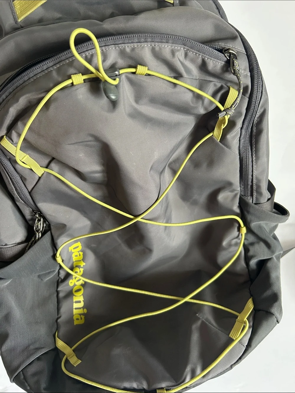 Patagonia Gray Backpack with Yellow Bungee Accents